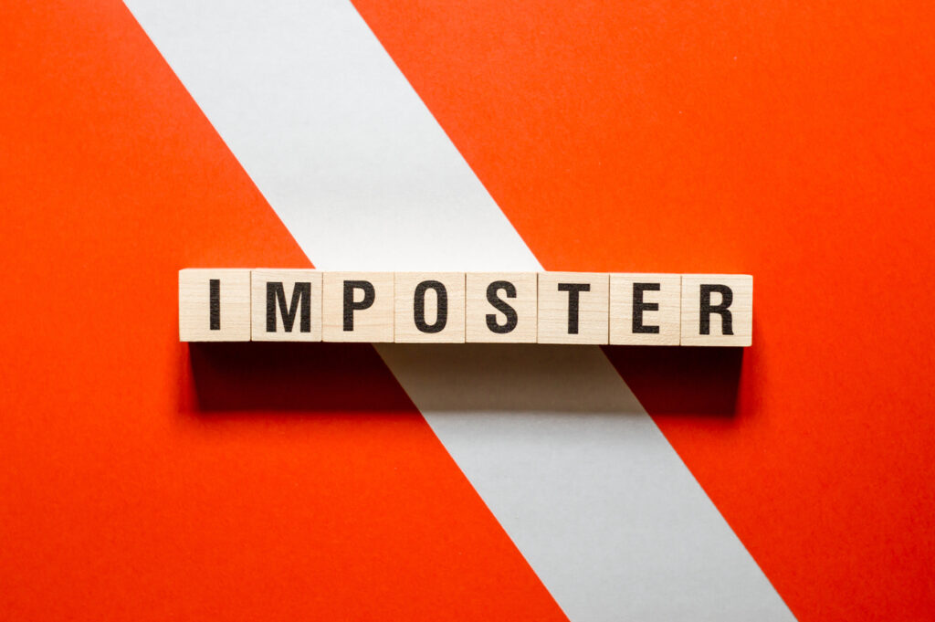 Imposter word concept on cubes.